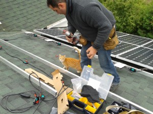 Solar panels being installed on roof of the UU Church of Olinda